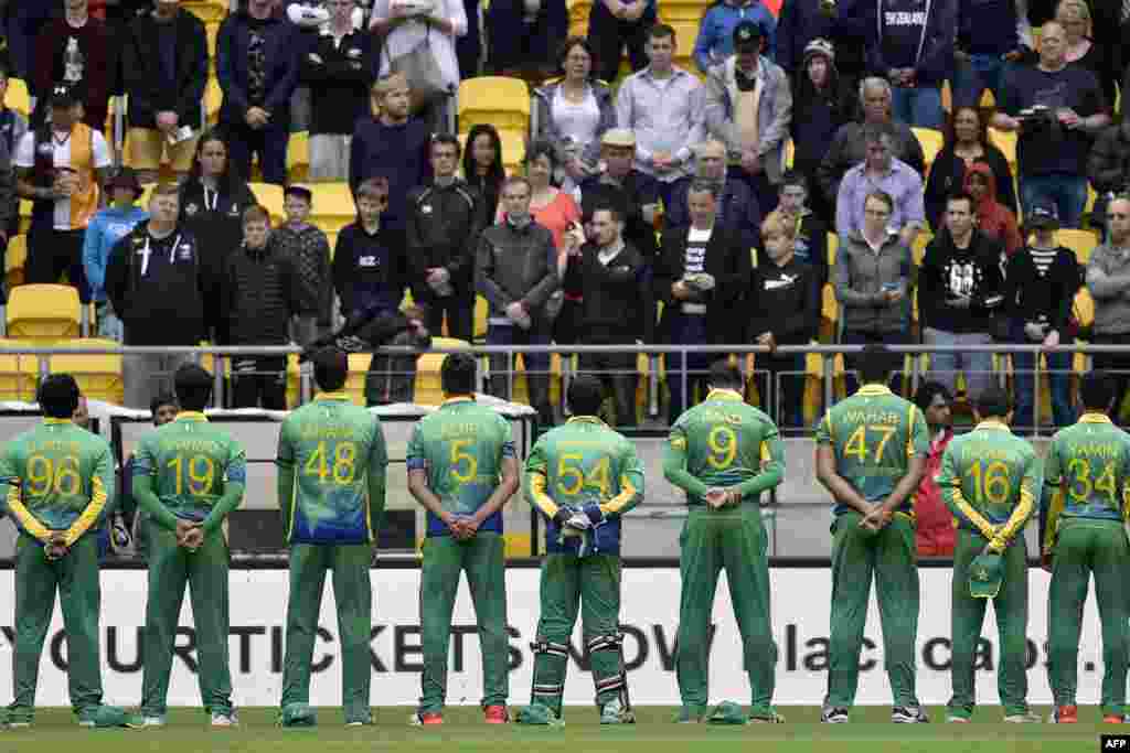 New Zealand -- Pakistan players stand for a moments silence for those killed in a terror attack in northwest Pakistan during the third T20 cricket match between New Zealand and Pakistan in Wellington at Westpac Stadium, January 22,2016