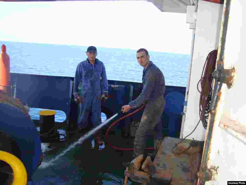 Zurab Guralia, left, and Giorgi Kurashvili on board the "Vasilios N." - The ship originally set out with a 10-person crew -- six Georgians, three Ukrainians, and one Azerbaijani -- although one Georgian crew member was shipped home after falling ill from hepatitis. The common language on board was Russian. "We're one crew, one family," one of the sailors said.