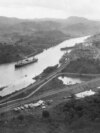 Panama -- The New York-registered SS Ancon crosses the Culebra cut of the Panama Canal on opening day, as seen from Cerro Luisa, looking north, August 15, 1914