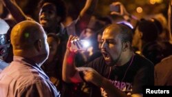 Протесты в Фергюсоне, вспыхнувшие в городе после убийства афроамериканца.