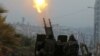 Free Syrian Army fighters firing an anti-aircraft weapon in a rebel-held area of Aleppo last year