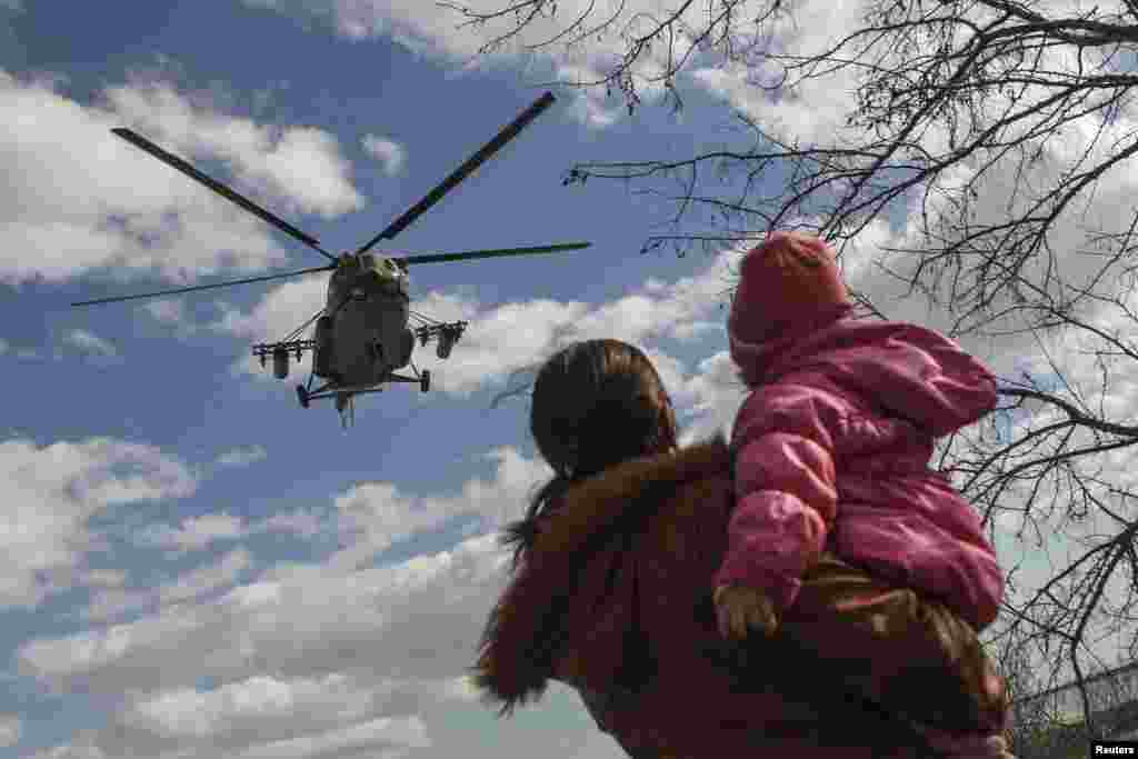 A Ukrainian MI-8 military helicopter is seen near the village of Salkovo in the Kherson region adjacent to Crimea on March 18. (Reuters/Valentyn Ogirenko)