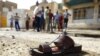 A shoe lies on the ground near the site of a suicide bomb at a mosque in New Baghdad.