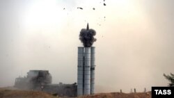 A Russian surface-to-air S-300 missile system is fired during a military drill late last year. 