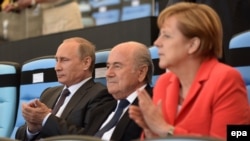 Meeting before the World Cup in Brazil, Russian President Vladimir Putin (left) and German Chancellor Angela Merkel (right) called for peace talks between Ukraine and the rebels to be held as soon as possible.