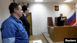 Aleksandr Cherkasov (L), head of Russian human rights group Memorial, attending a court hearing in Moscow last year. 