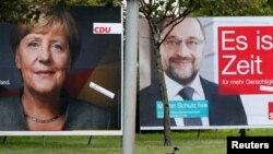 Pamje e fotografive të liderëve politikë, Angela Merkel dhe Martin Schulz, gjatë fushatës zgjedhore në Gjermani