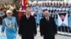 Russian President Vladimir Putin (right) and his Turkish counterpart, Recep Tayyip Erdogan, review an honor guard during a welcoming ceremony in Ankara on December 1.