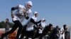 Afghan schoolgirls take part in a running race held for a peace initiative in the western Herat Province. (AFP/Aref Karimi)