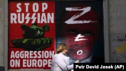 Плакат с требованием остановить российскую агрессию, Варшава, Польша