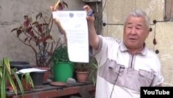 Kazakhstan – Zeysh Korzhinbaev, home owner in Almaty set fire on court decision on eviction. Screenshot from YouTube. Undated