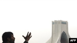 President Mahmud Ahmadinejad addresses the crowd during a rally to mark the 30th anniversary of the Islamic Revolution.