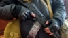 An armed man, believed to be a pro-Russian protester, stands guard inside the offices of the Ukrainian Security Service in Luhansk on April 7.