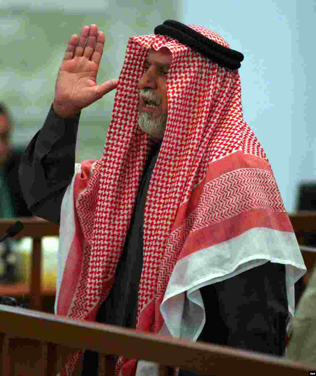 Awad al-Bandar listens to the verdict against him (epa) - Awad al-Bandar, the former head of Hussein's revolutionary court, was sentenced to death by hanging.