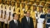 Iraqi Prime Minister Nuri al-Maliki (right), accompanied by Chinese Premier Wen Jiabao, reviews the military honor guard during a welcome ceremony at the Great Hall of the People in Beijing on July 18.