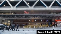 Police and other first responders arrive on the scene following a reported explosion at the Port Authority Bus Terminal in New York on December 11. 