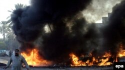 Four people were killed when three car bombs exploded in Baghdad on December 15.
