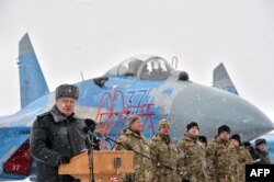 File photo of Ukrainian President Petro Poroshenko addressing servicemen