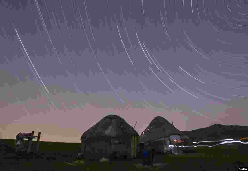 Star trails form over yurts in a long exposure photograph taken on Kazakhstan's Assy plateau, east of Almaty. (Reuters/Shamil Zhumatov)