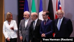 BELGIUM -- Britain's Foreign Secretary Boris Johnson, German Foreign Minister Heiko Maas, French Foreign Minister Jean-Yves Le Drian and EU High Representative for Foreign Affairs Federica Mogherini take part in meeting with Iran's Foreign Minister Mohamm