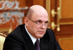 As the former head of Russia's taxation service, new Prime Minister Mikhail Mishustin could be well suited to oversee implementation of the new taxes. (file photo)