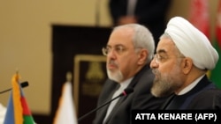 Iranian President Hassan Rouhani (R), with Foreign Minister Mohammad Javad Zarif. File photo.