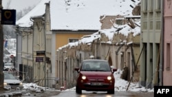 Croatia - A car drives along a street in Petrinja on January 12, 2021