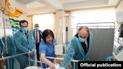 Prime Minister Nikol Pashinian (R) and Health Minister Arsen Torosian (L) visit 13-year-old Nazeli Khachatrian in hospital, Yerevan, March 8, 2020