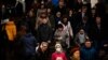 RUSSIA -- A woman with a protective face mask walks on the platform at Biblioteka Imeni Lenina metro station in Moscow, March 10, 2020