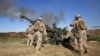 U.S. Marines fire a howitzer at an IS infiltration route in March 2016.