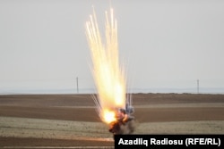 Unexploded ordnance is detonated as part of a clearance operation in the Fuzuli and Cabrayil districts late last year.