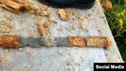Sword discovered with a skeleton and other artifacts during COVID-19 burial in Iran.