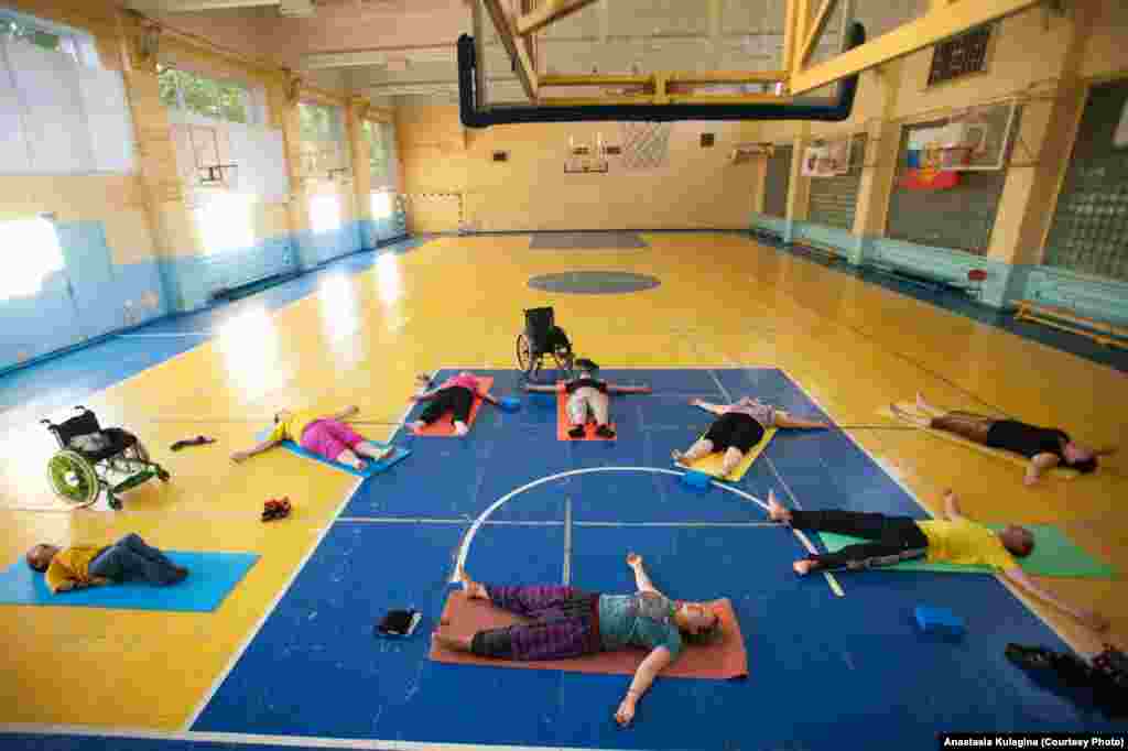 Elena also organizes therapy sessions for sufferers of the disorder. A gentle form of yoga is possible but only if the instructor knows exactly the limits of her students. Elena knows. For the full version of this picture story (in Russian) click here.&nbsp;