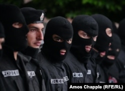 Police stand by as night falls on Yerevan's Republic Square on April 19.