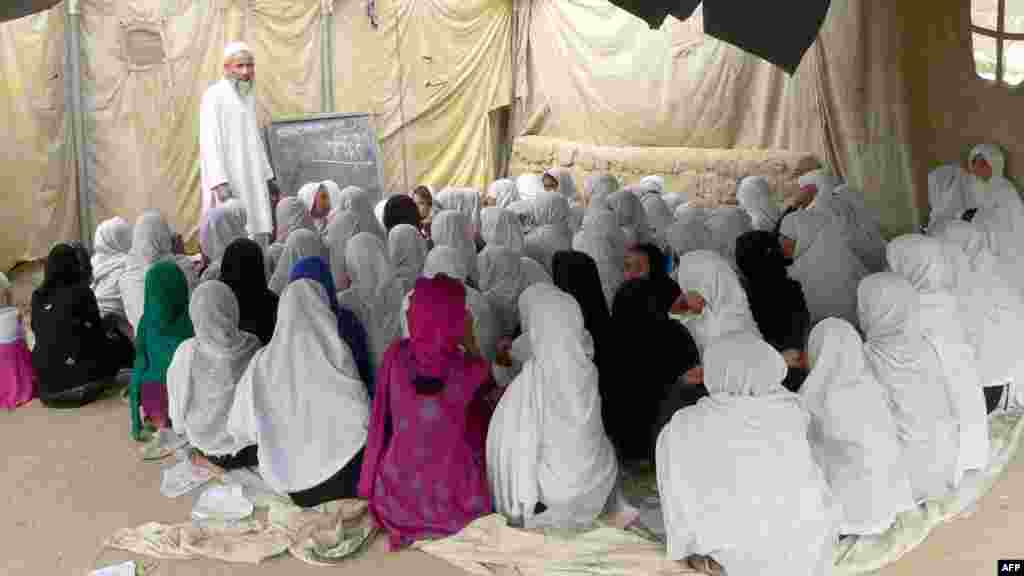 Girls study in an open-air school on the outskirts of Jalalabad, Afghanistan.