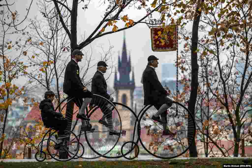 Participants wearing historical dress ride penny-farthing bicycles during the traditional Prague Mile race in the Czech capital on November 4. (epa-EFE/Martin Divisek)