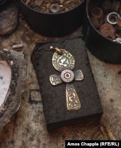 A crucifix etched with a dove of peace