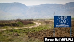 A sign shows an area cleared of land mines in Nagorno-Karabakh.