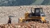 Montenegro - A worker hides from the sun on the Bar-Boljare highway construction site in Klopot, Montenegro June 11, 2018. Picture taken June 11, 2018. 