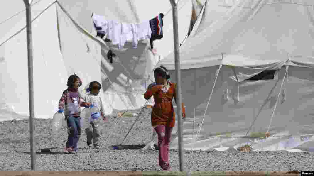 Syrian refugees stroll at the Islahiye refugee camp in Gaziantep, Turkey.
