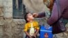A boy receives polio vaccine drops during an anti-polio campaign in a low-income neighborhood in Karachi on April 9.