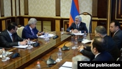 Armenia -- President Serzh Sarkisian meets with the members of a presidential commission on constitutional reform, 24 June, 2014.