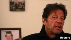 Pakistan - Imran Khan, Pakistani cricketer-turned-politician and chairman of the Pakistan Tehreek-e-Insaf (PTI) political party, speaks during an interview with Reuters at his office in Islamabad November 8, 2013.