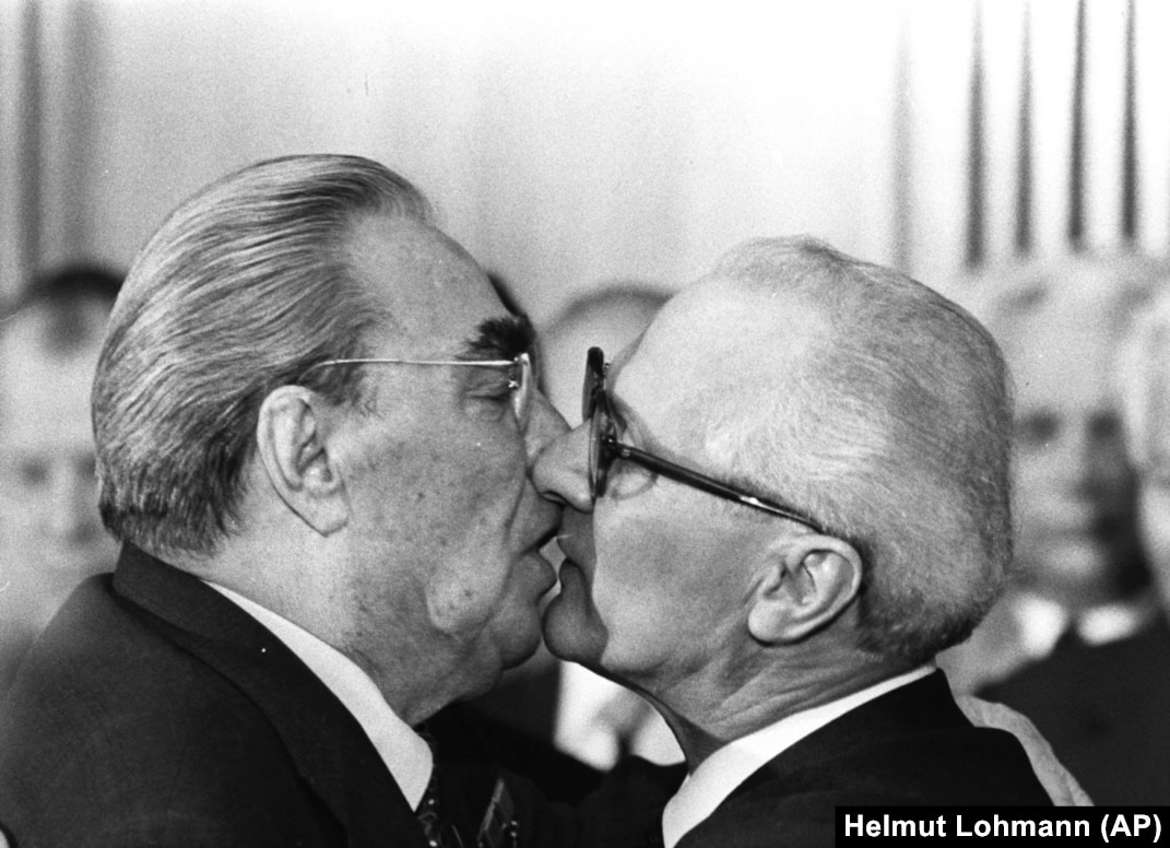 Men kissing old Two Men