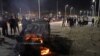 IRAN -- Iranians gather at the site of a bus accident with a fuel truck in Sanandaj, the capital of Iran's Kurdistan province, July 11, 2018