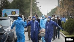 The body of Fatemeh Rahbar being taken away for burial. She was a newly elected member of parliament who died of coronavirus on March 7, 2020