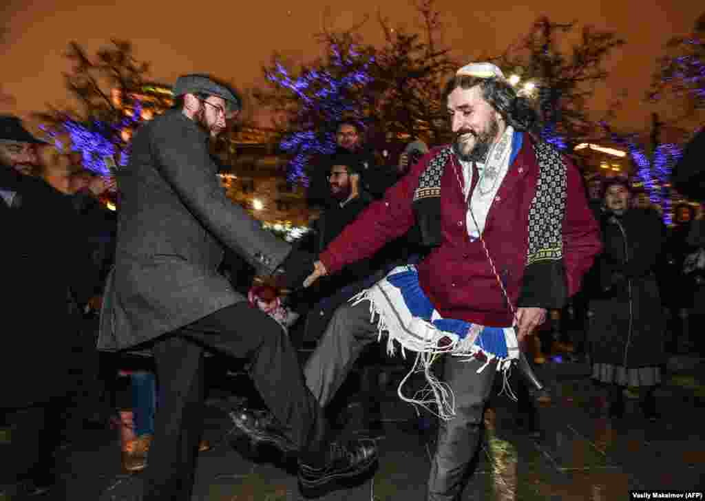 Jewish people dance during Hanukkah celebrations in central Moscow on December 12. (AFP/Vasily Maximov)