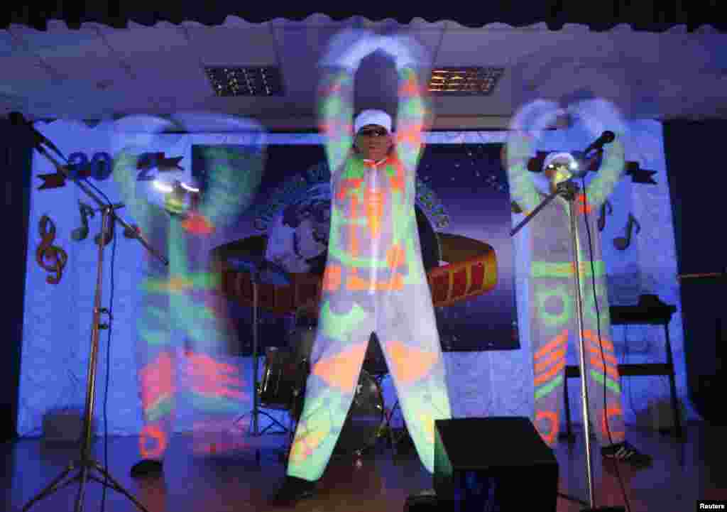 Participants perform during a regional round of a talent competition for prison inmates at a Russian prison camp in the Siberian city of Krasnoyarsk. (Reuters/Ilya Naymushin)