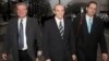 Former Blackwater security guard Nick Slatten (center) leaves a federal courthouse with attorneys in January 2009. (file photo) 