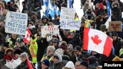 Канадада оңчулдардын БУУнун миграция макулдашуусуна каршы демонстрациясы. Оттава, 8-декабрь, 2018-жыл.